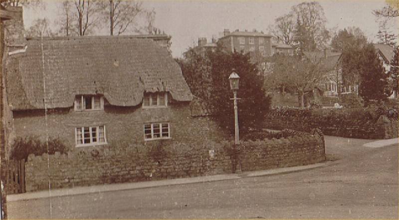 Archive photo of thatched cottage at junction of Church Road and Wembdon Hill