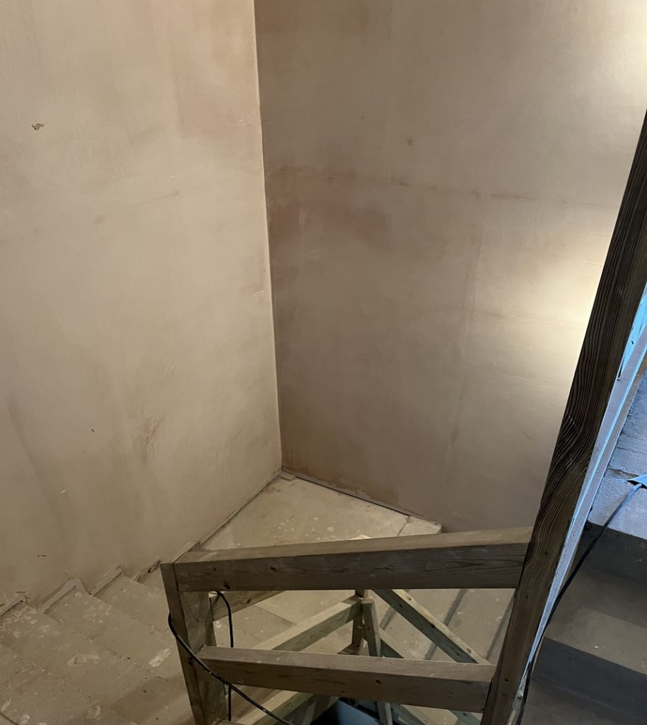 The stairwell at the Village Hall newly plastered